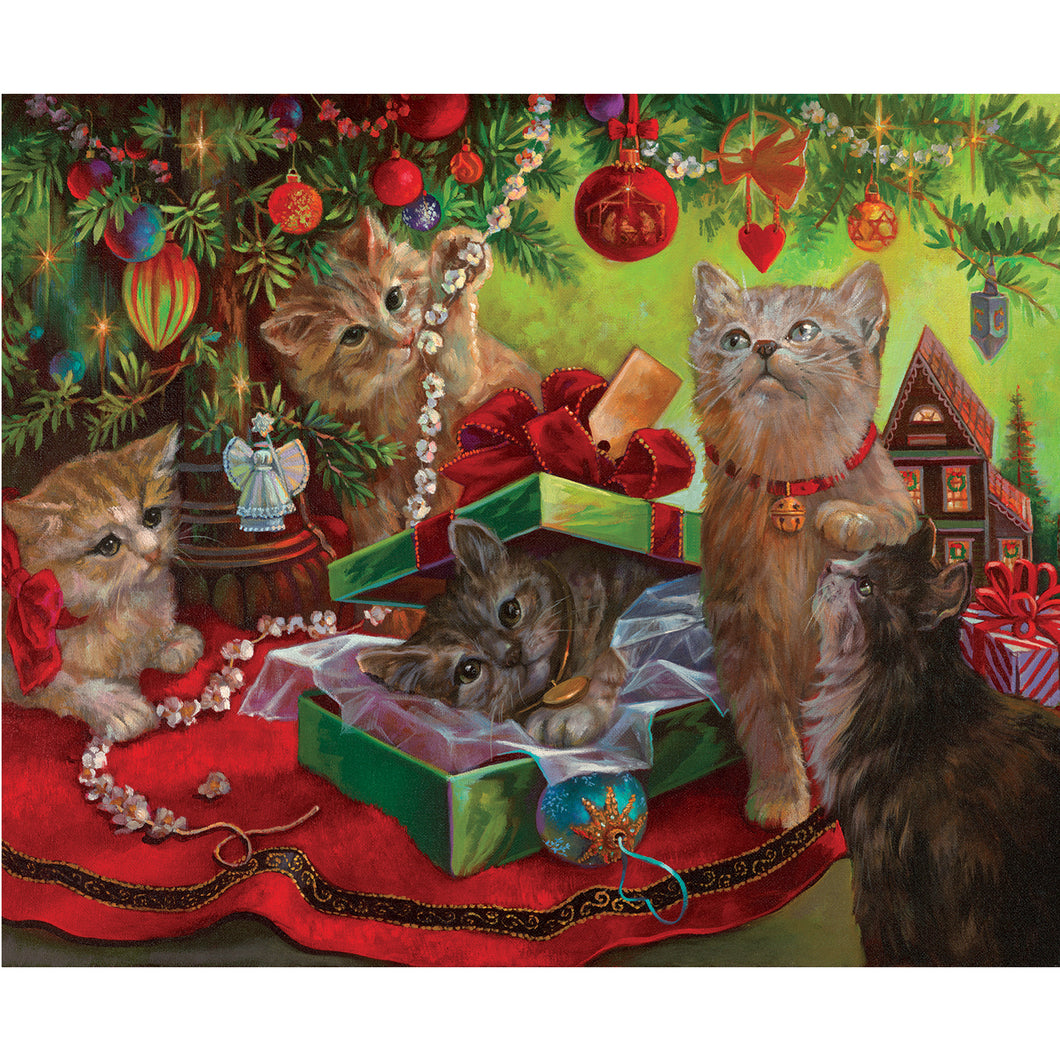 Kattungar under julgranen